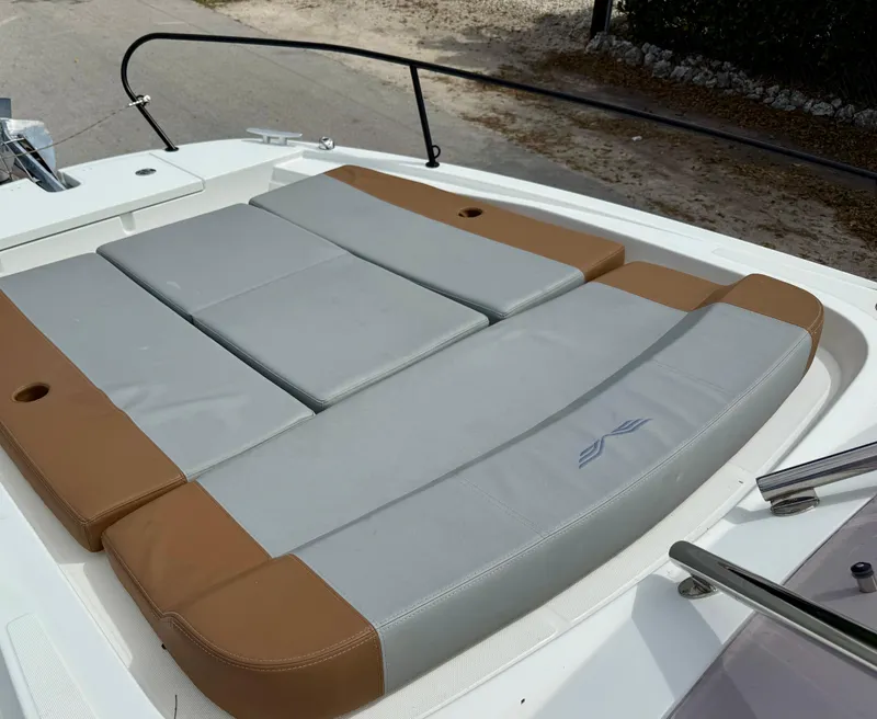 Slide: The Image of 2023 Beneteau Flyer 9 SUNdeck with spacious sunbathing area, featuring gray and brown cushions. - 38