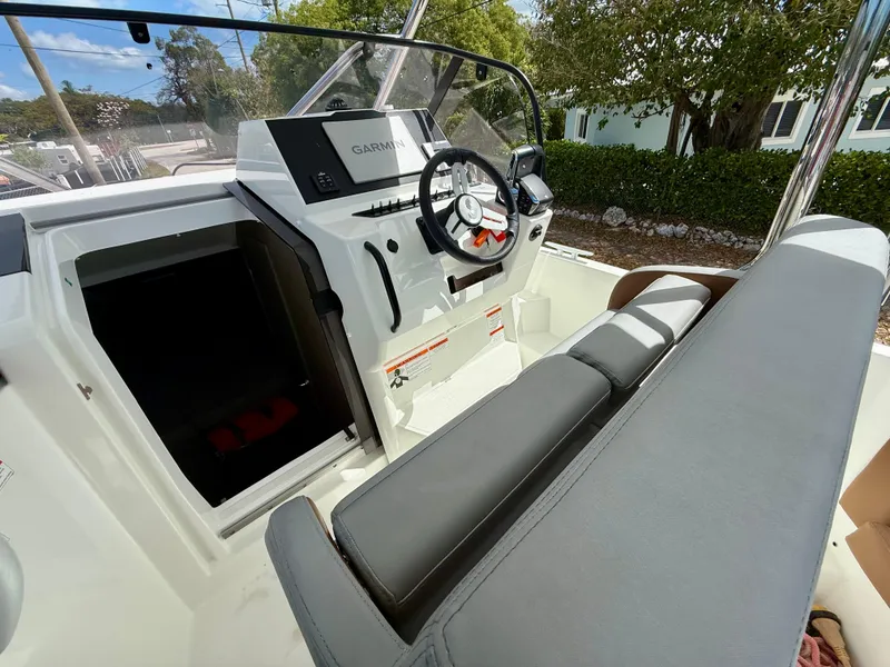 Slide: The Image of 2023 Beneteau Flyer 9 SUNdeck cockpit with steering wheel and navigation system. - 39