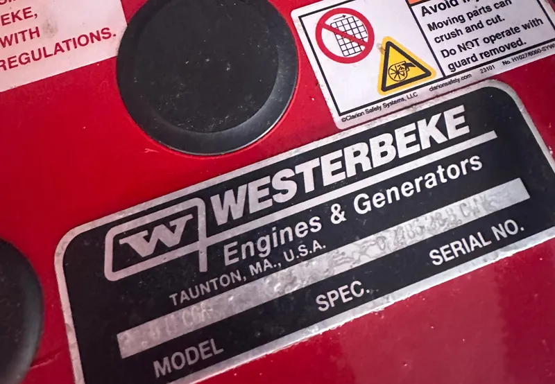 Slide: The Image of Westerbeke engine label on Beneteau Flyer 9 SUNdeck 2023, featuring safety warnings and specifications. - 44