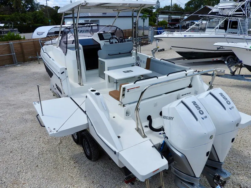 Slide: The Image of 2023 Beneteau Flyer 9 SUNdeck with dual Mercury engines, docked on gravel. - 8