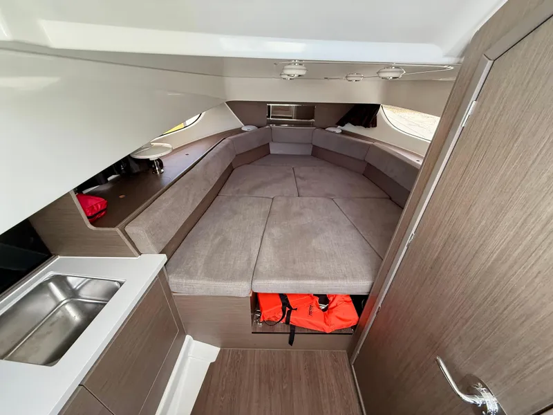 Slide: The Image of 2023 Beneteau Flyer 9 SUNdeck interior with spacious seating and modern amenities. - 9