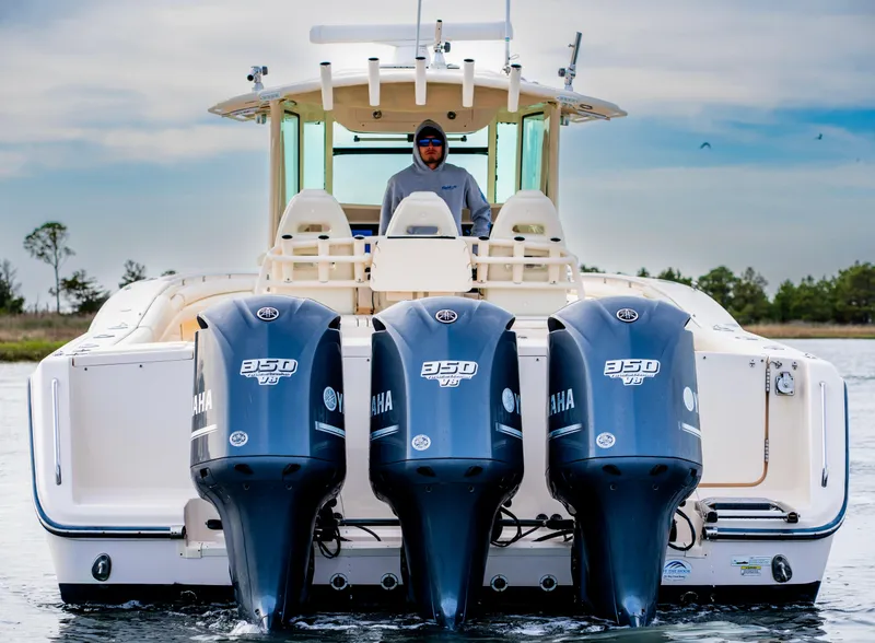 Slide: The Image of 2015 Grady-White Canyon 376 boat with triple Yamaha 350 engines on water. - 5