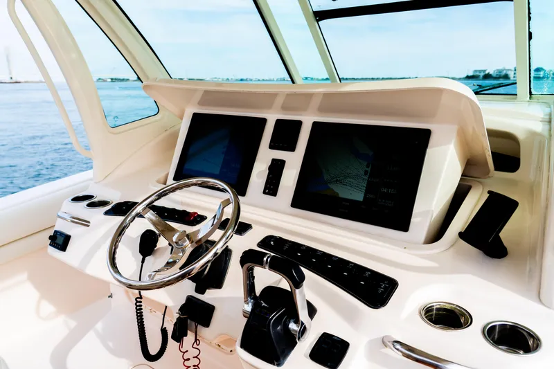 Slide: The Image of Helm of 2015 Grady-White Canyon 376 boat with modern navigation equipment. - 8