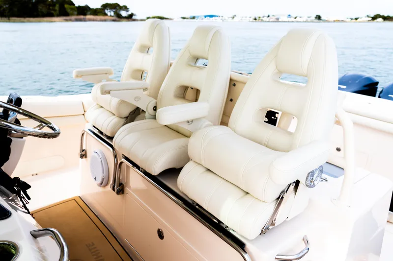 Slide: The Image of 2015 Grady-White Canyon 376 boat with luxurious white seating on deck. - 9