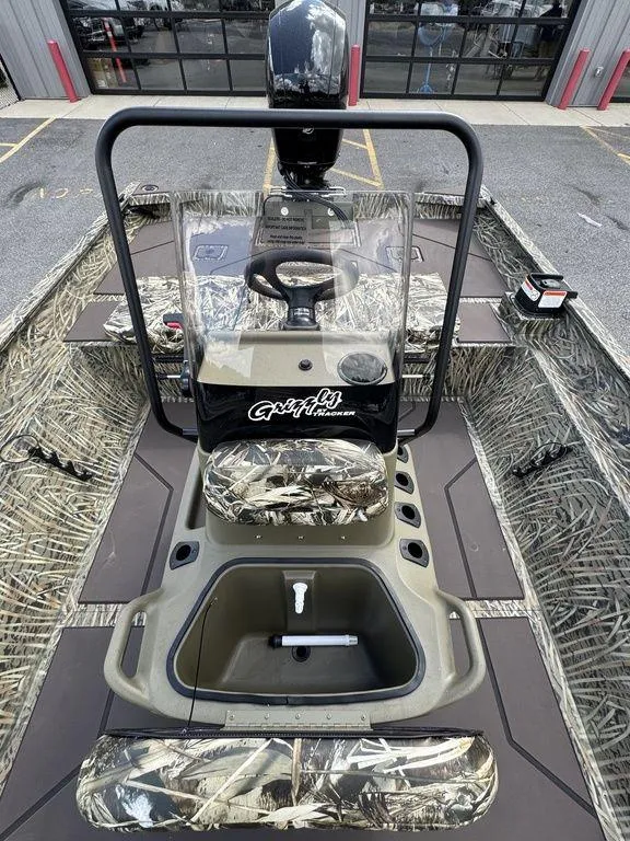 Slide: The Image of 2025 Tracker GRIZZLY® 2072 CC boat with camouflage interior and center console. - 14