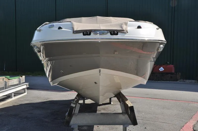Slide: The Image of 2018 Stingray 214 LR boat on a stand, front view. - 7