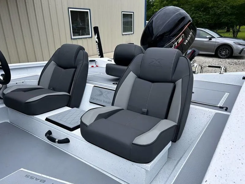 Slide: The Image of 2025 Xpress H18 Bass boat interior with dual gray seats and motor. - 8