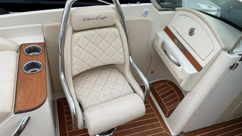 Slide: The Image of 2017 Chris-Craft Launch 28 interior with luxurious seating and wood accents. - 11