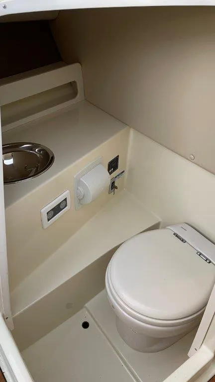 Slide: The Image of 2017 Chris-Craft Launch 28 boat interior with compact bathroom amenities. - 15