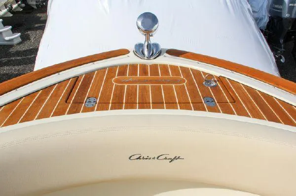 Slide: The Image of 2017 Chris-Craft Launch 28 boat with elegant wood deck and chrome details. - 9