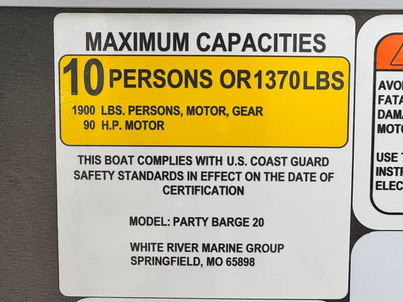 Slide: The Image of Sun Tracker Party Barge 20 DLX 2023 capacity label: 10 persons or 1370 lbs, 90 HP motor. - 20
