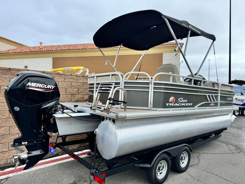 Slide: The Image of 2023 Sun Tracker Party Barge 20 DLX pontoon boat with Mercury engine on trailer. - 5