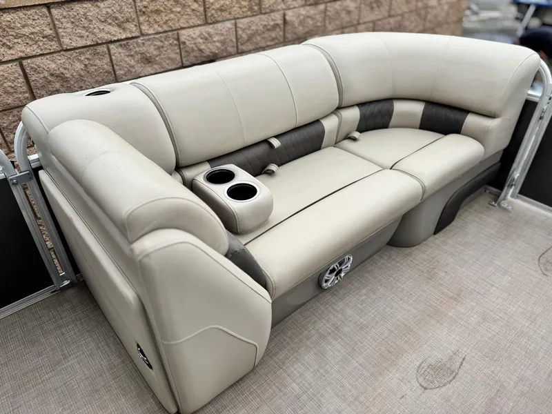 Slide: The Image of 2023 Sun Tracker Party Barge 20 DLX pontoon boat seating with cup holders and speaker. - 9