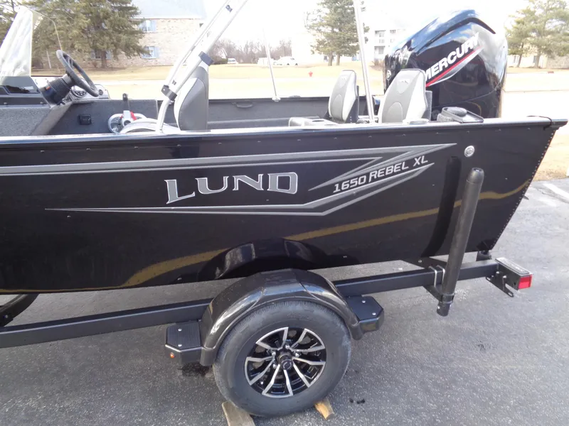 Slide: The Image of 2025 Lund 1650 Rebel XL SS boat with Mercury engine on a trailer. - 22