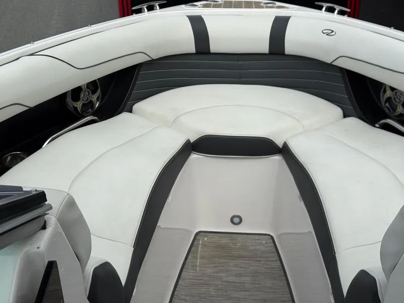 Slide: The Image of 2016 Regal 2300 Bowrider interior with white and black seating, showcasing luxury design. - 4