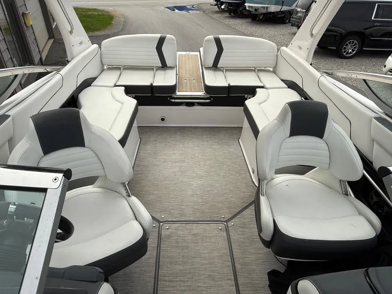 Slide: The Image of 2016 Regal 2300 Bowrider interior with white and black seating, spacious layout. - 7