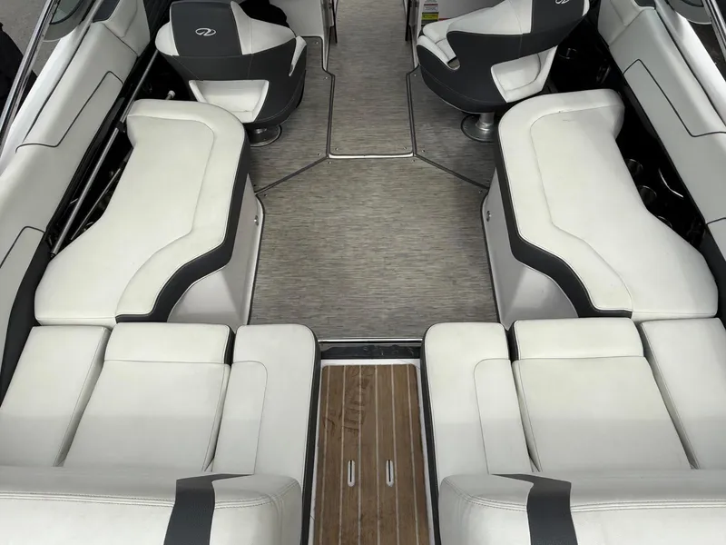 Slide: The Image of 2016 Regal 2300 Bowrider interior with white seating and wood accents. - 8