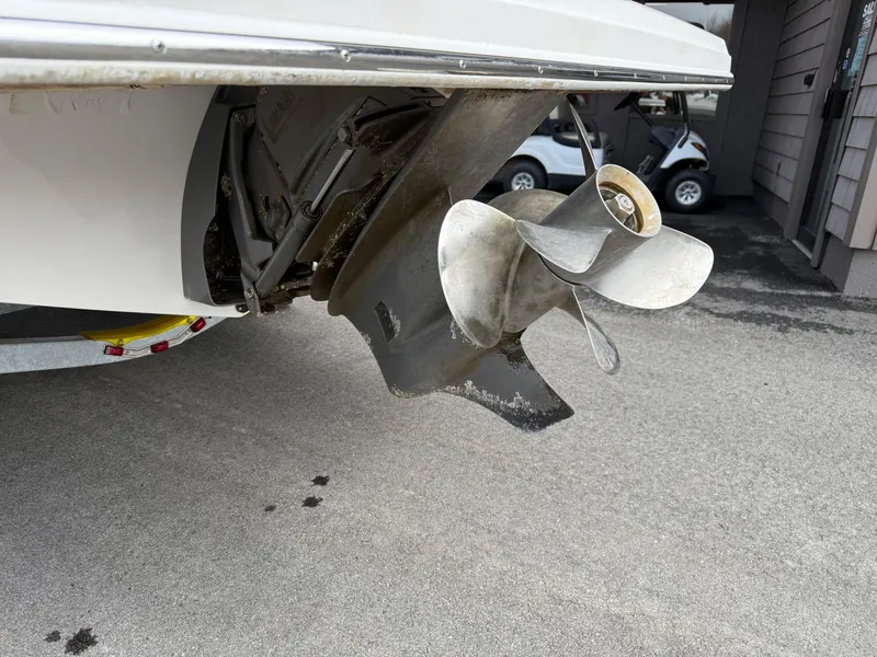 Slide: The Image of 2016 Regal 2300 Bowrider boat propeller on a trailer, close-up view. - 9
