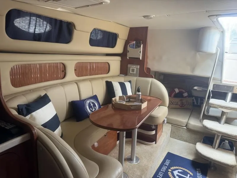 Slide: The Image of Interior of 2004 Rinker 342 Fiesta Vee yacht with cozy seating and nautical decor. - 19