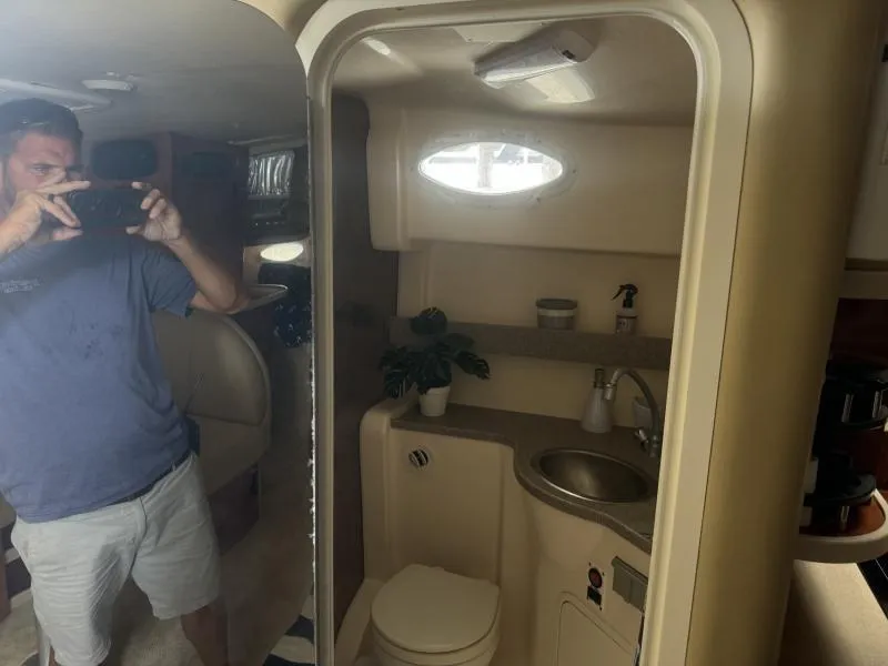 Slide: The Image of 2004 Rinker 342 Fiesta Vee boat interior with bathroom and sink. - 21