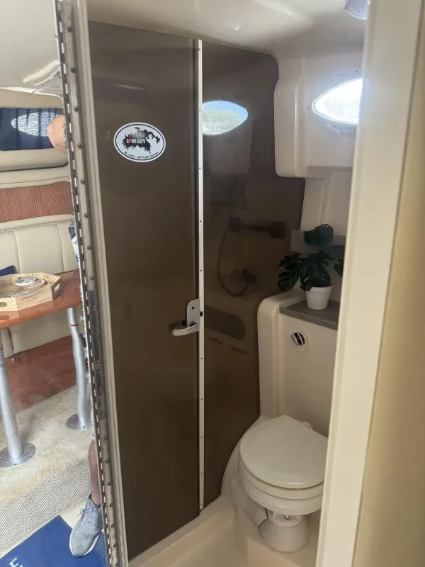 Slide: The Image of 2004 Rinker 342 Fiesta Vee boat bathroom with shower and toilet. - 22