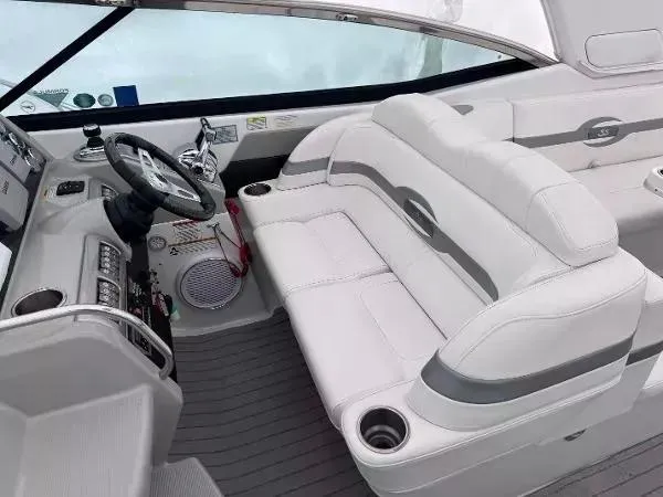 Slide: The Image of Interior of a 2012 Formula 350 SS boat with white seating and modern dashboard. - 10
