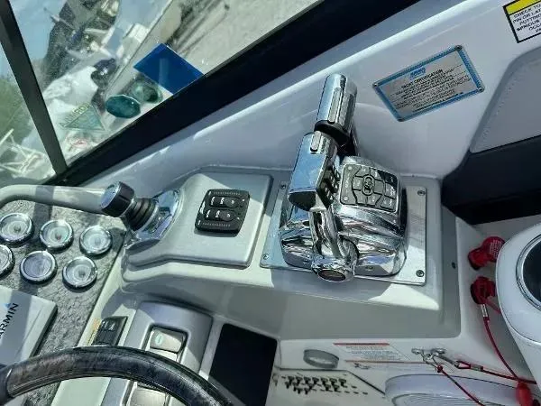 Slide: The Image of Control panel of a 2012 Formula 350 SS boat with chrome throttle levers. - 11