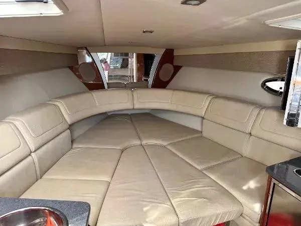 Slide: The Image of 2012 Formula 350 SS boat interior with beige seating and modern design. - 14