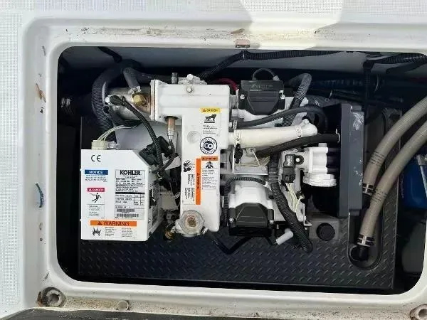 Slide: The Image of Engine compartment of a 2012 Formula 350 SS boat, featuring a Kohler generator. - 19