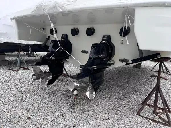 Slide: The Image of 2012 Formula 350 SS boat with dual outboard motors on gravel. - 3