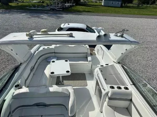 Slide: The Image of 2012 Formula 350 SS boat with spacious white seating and table setup. - 5