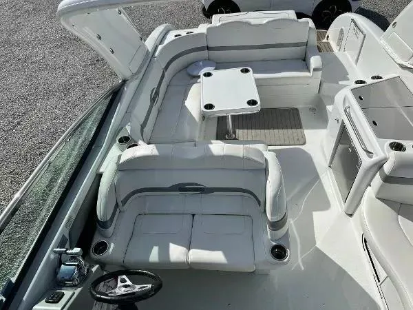 Slide: The Image of 2012 Formula 350 SS boat interior with white seating and table, viewed from above. - 6