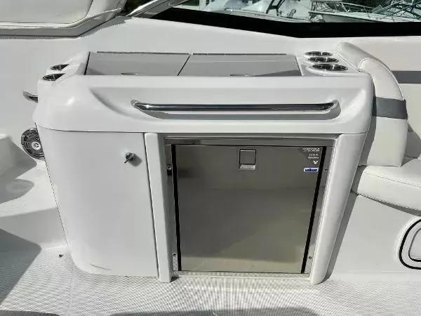 Slide: The Image of 2012 Formula 350 SS boat interior with stainless steel cabinet and cup holders. - 7