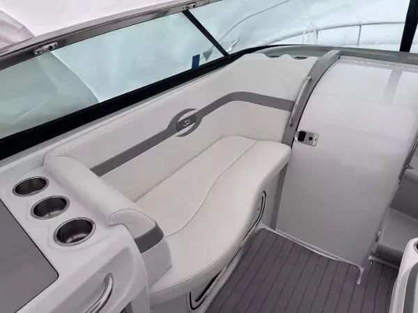 Slide: The Image of 2012 Formula 350 SS boat interior with white seating and cup holders. - 8