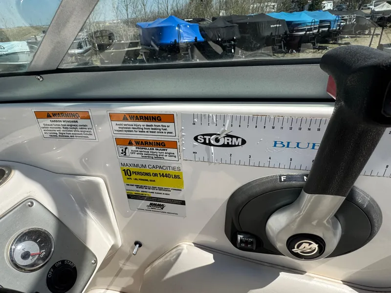 Slide: The Image of 2008 Hurricane SunDeck 2400 IO boat dashboard with steering wheel and gauges. - 10