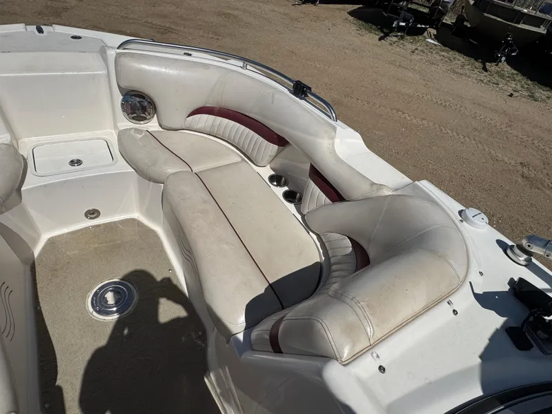 Slide: The Image of 2008 Hurricane SunDeck 2400 IO boat interior with white and maroon seating. - 13