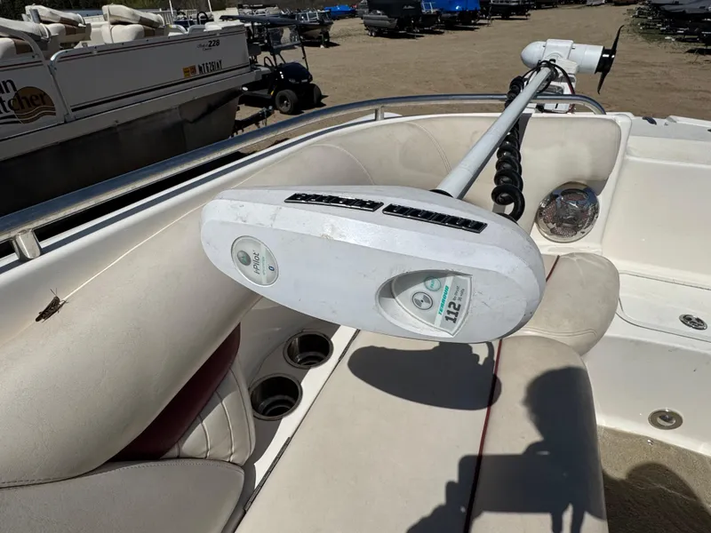 Slide: The Image of 2008 Hurricane SunDeck 2400 IO boat interior with white and maroon seating. - 15