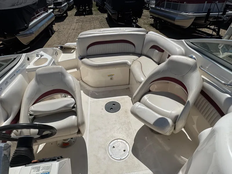 Slide: The Image of 2008 Hurricane SunDeck 2400 IO boat interior with speaker and storage compartment. - 16
