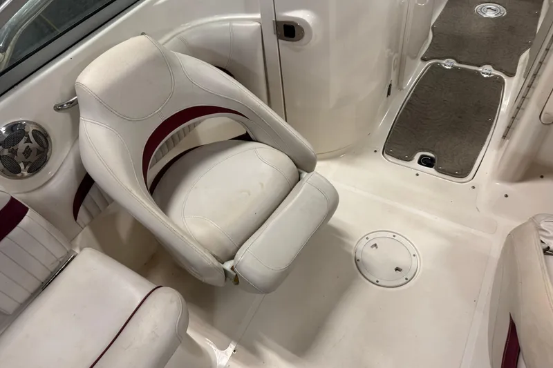 Slide: The Image of 2008 Hurricane SunDeck 2400 IO boat interior with white and maroon seating. - 20
