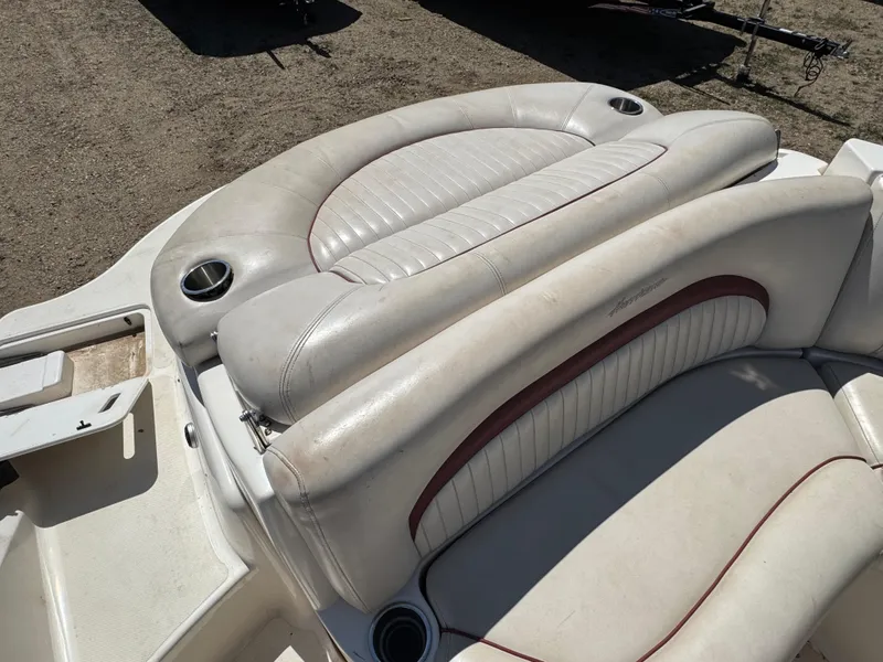 Slide: The Image of 2008 Hurricane SunDeck 2400 IO boat interior with white seating and equipment. - 5