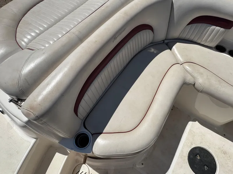 Slide: The Image of 2008 Hurricane SunDeck 2400 IO boat interior with white and maroon seating. - 6