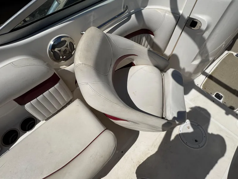 Slide: The Image of 2008 Hurricane SunDeck 2400 IO boat interior with seating and storage compartment. - 7