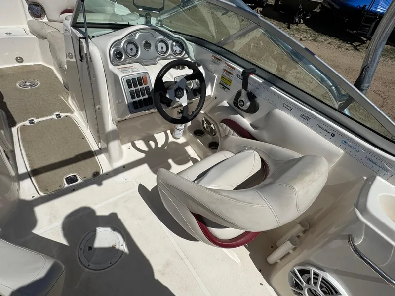 Slide: The Image of 2008 Hurricane SunDeck 2400 IO with Minn Kota i-Pilot trolling motor in a garage. - 8