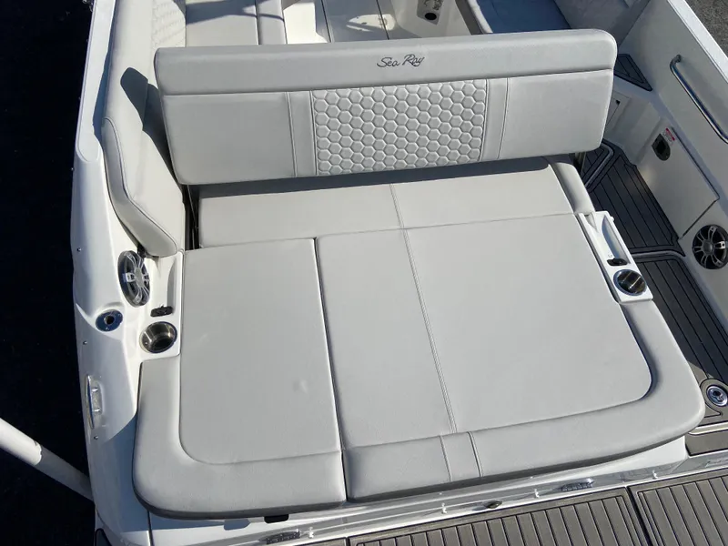 Slide: The Image of 2023 Sea Ray SDX 250 boat with luxurious white seating and cup holders. - 5