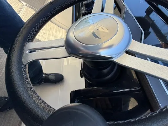 Slide: The Image of Steering wheel of a 2018 Sea Ray SLX 310 boat, close-up view. - 5