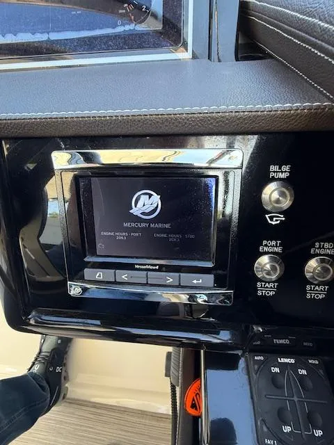 Slide: The Image of Control panel of a 2018 Sea Ray SLX 310 boat with Mercury Marine display. - 7