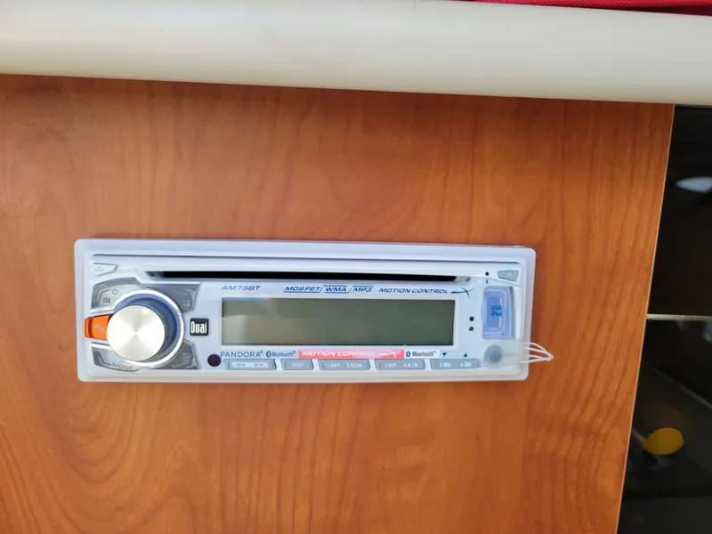 Slide: The Image of 2005 Bayliner 265 boat stereo system on wooden panel. - 23