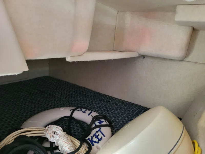 Slide: The Image of 2005 Bayliner 265 interior with life preserver and ropes. - 26