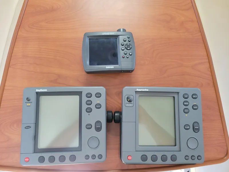 Slide: The Image of Marine navigation equipment on a wooden table, compatible with 2005 Bayliner 265 boat. - 32