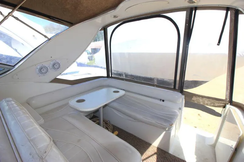 Slide: The Image of Interior of 1999 Maxum 2800 SCR boat with seating and table. - 6